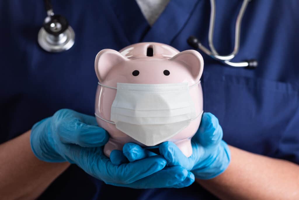 Nurse with piggy bank