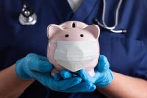 Nurse with piggy bank